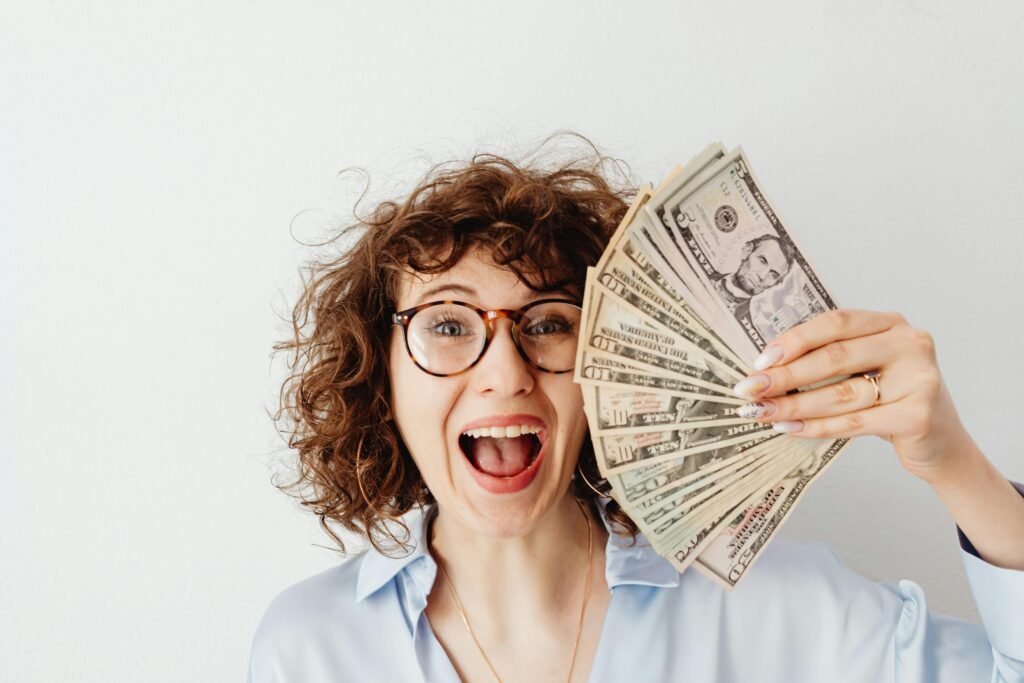 Happy woman excited to win $1000 PayPal prepaid card – USA giveaway winner